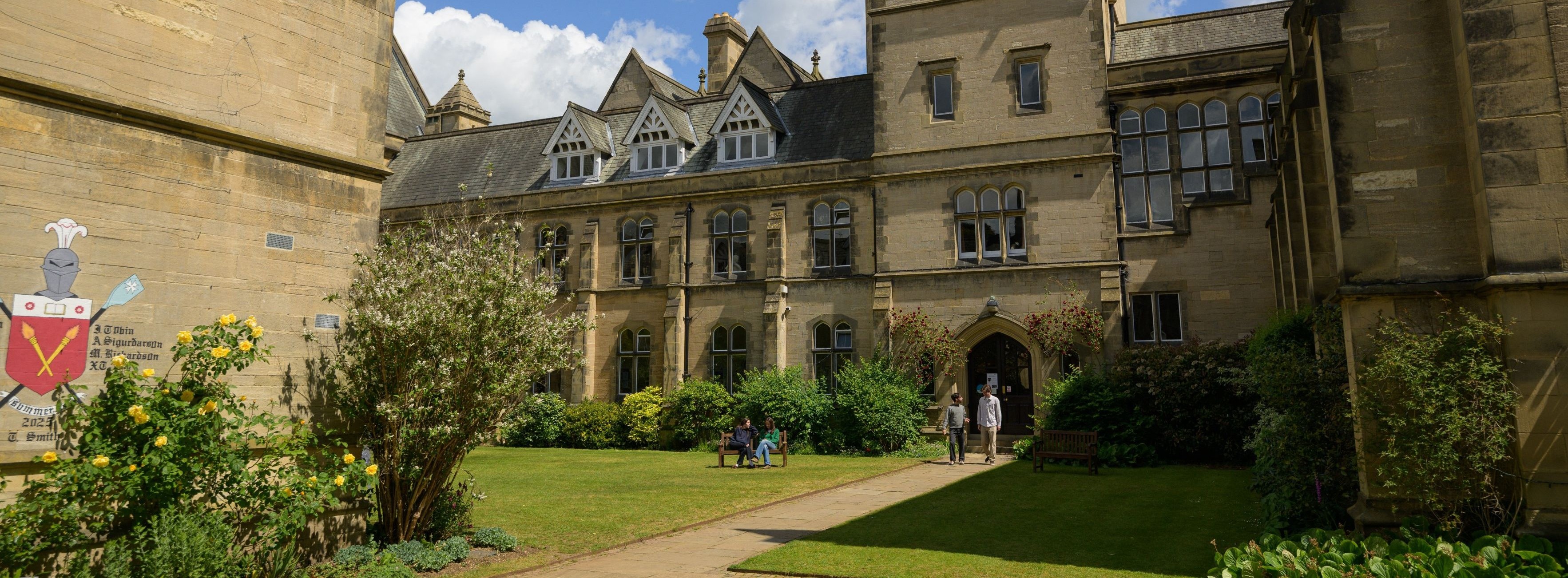 College quad with students walking out of a building