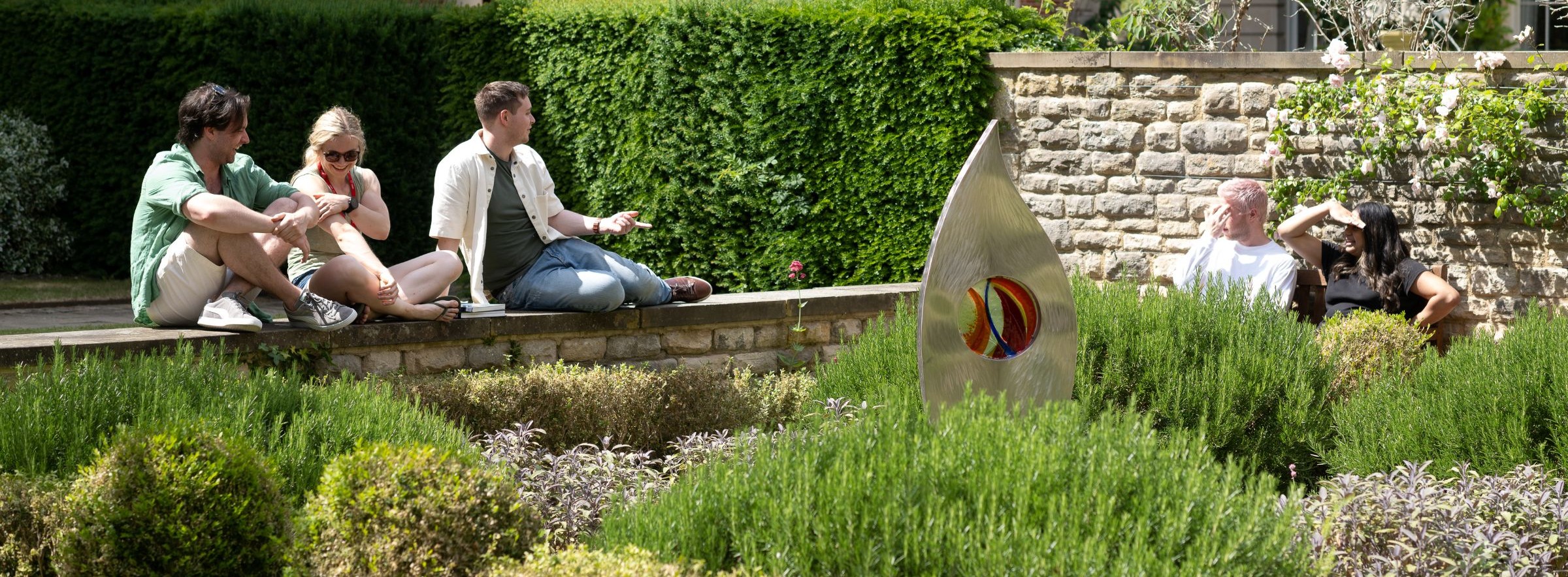 Students sitting in the College garden