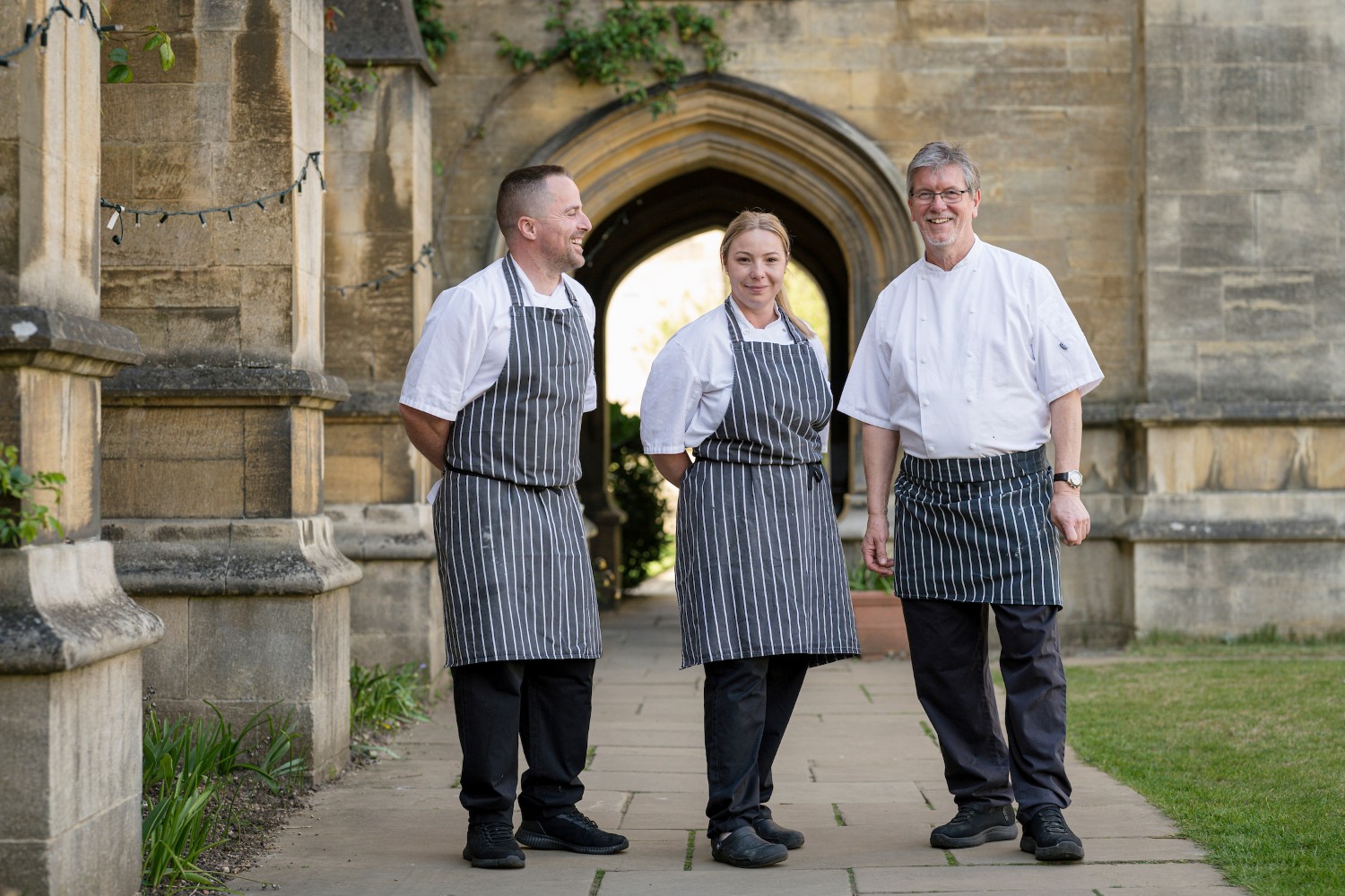Chefs Steve Ramli-Davies, Xhevahir (“Jay”) Gjoci and Paulina Krawaczynska standing outside the dining hall