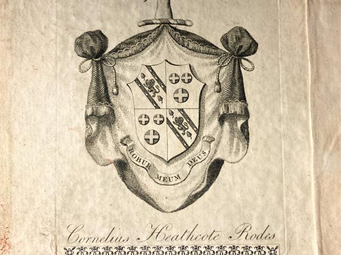Two bookplates are shown, one above the other.  The bookplates are different, one being a shield shape and more decorative and the other plain.