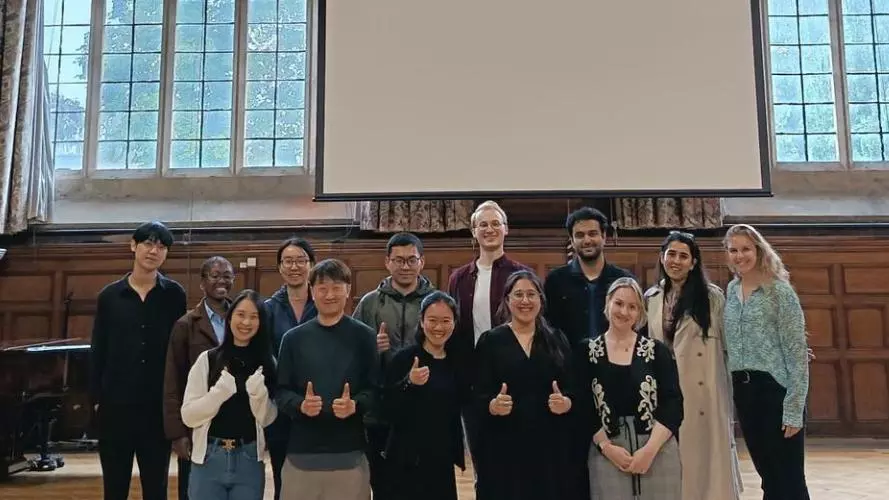 Group photo of Harris Manchester College postgraduate students and Homerton's MCR President. Photo taken by Jay Mok, 6 June 2026.