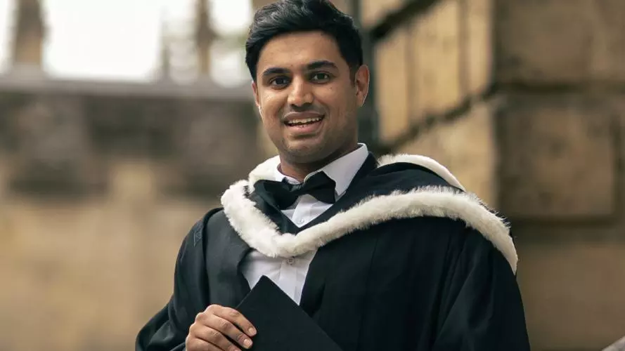 HMC student Hamza in academic gown