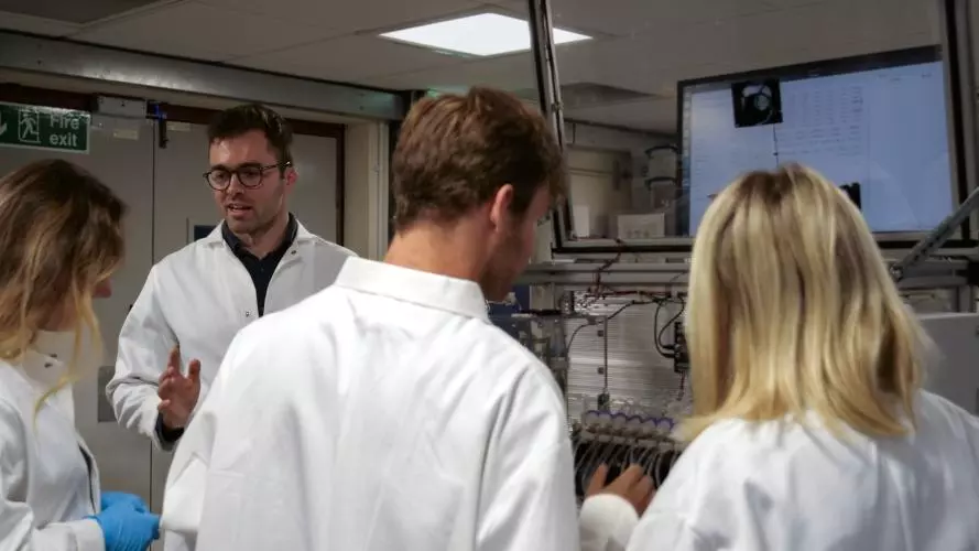 Group of people wearing lab coats