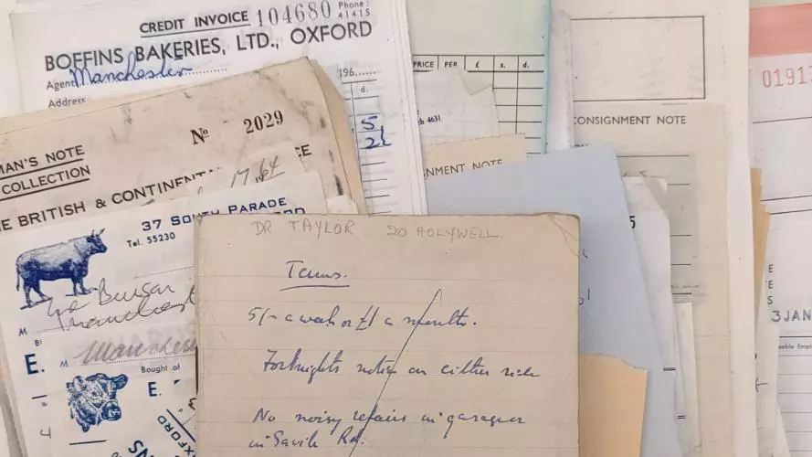 Photograph of a pile of bills relating to food from the 1960s