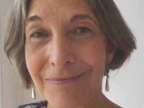 Photograph portrait of Susan James, facing forwards and smiling