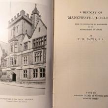 The open pages of a book with a black and white photograph of the college on the left side with the title A history of Manchester College on the right