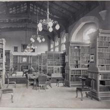 A long shot down the Library taken in the 1890s with furniture and bookcase in place
