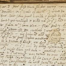 Closely handwritten page with stains 