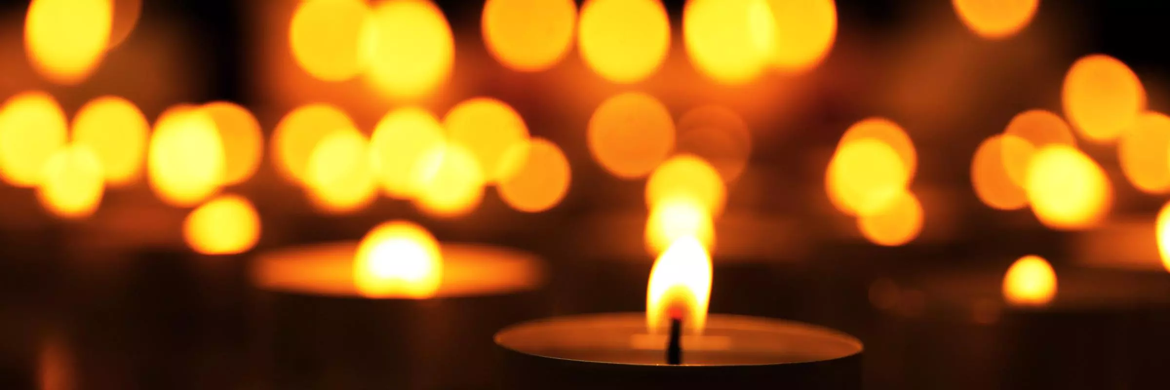 Candles burning in the dark