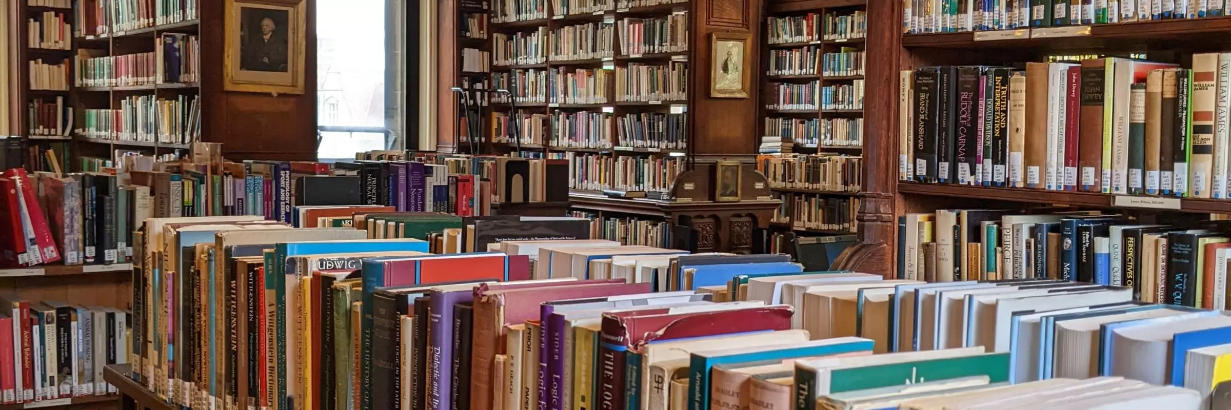 Photo of shelves of books in the Tate Library