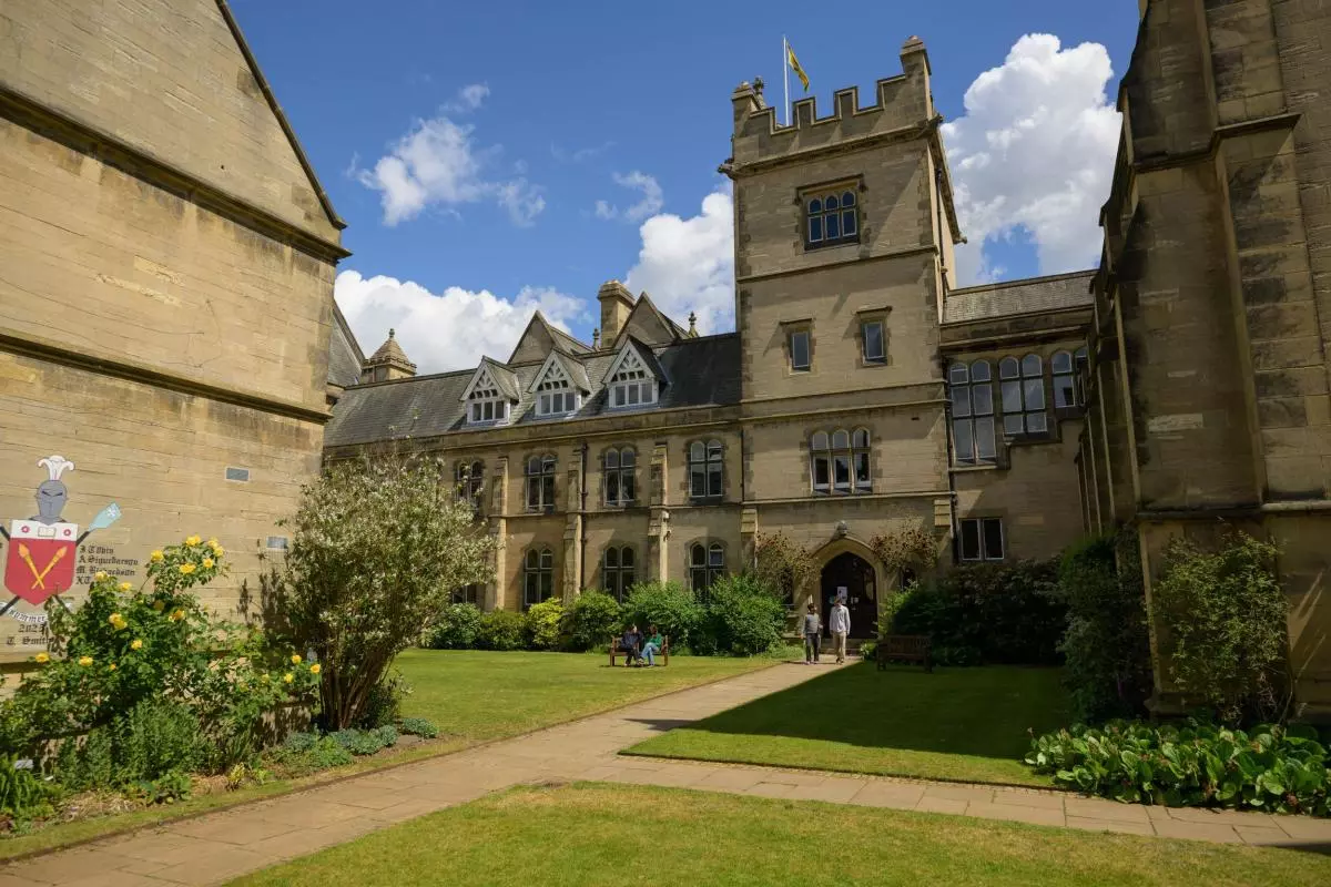 College quad with students walking out of the main building