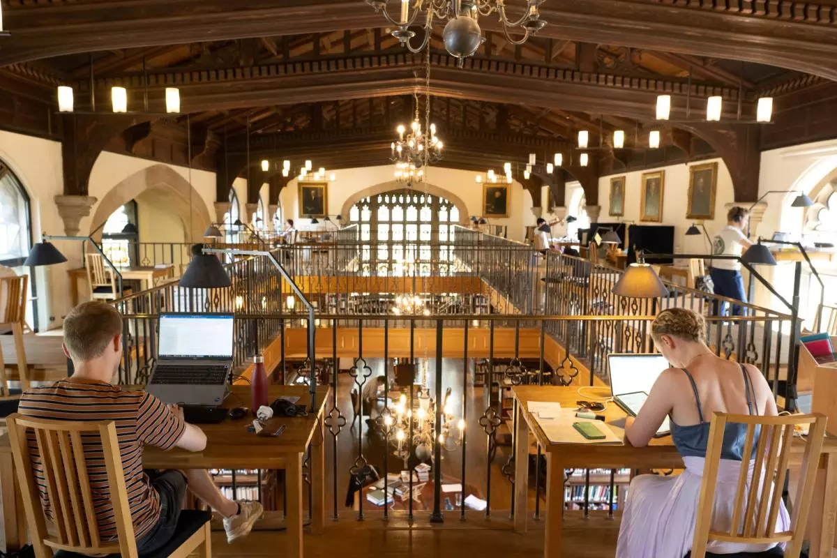 Students with computers in the library
